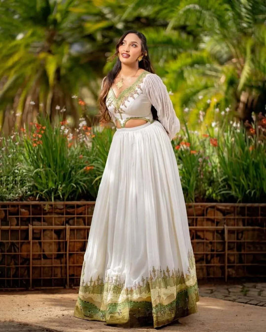 Woman in a white and green traditional outfit standing in a garden. Grass Green Modern Zuria Kemis Elegant Ethiopian Traditional Dress Ethgebya