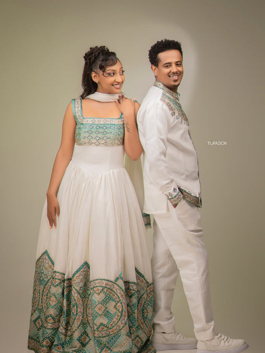 Man and woman in formal attire standing side by side against a plain background Habesha Matching Wedding & Cultural Set Ethgebya