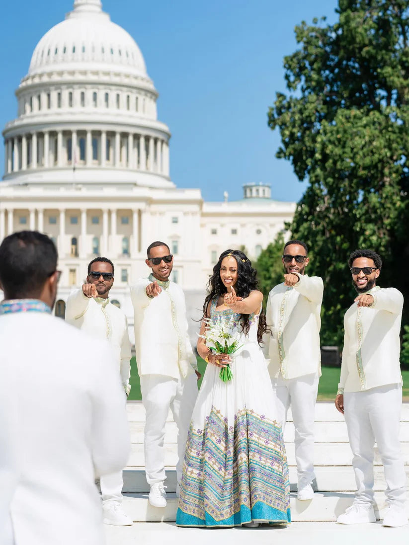 Group of people in formal attire with a person in a colorful dress in front of the U.S. Capitol building. Ethiopian Wedding Attire for Couples Habesha Traditional Matching Set Ethgebya