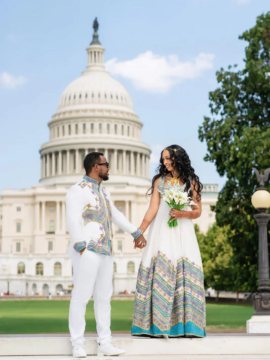 Couple in formal attire standing in front of the U.S. Capitol building. Ethiopian Wedding Attire for Couples Habesha Traditional Matching Set Ethgebya