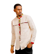 Man wearing a traditional outfit with a white shirt and colorful patterns on a white background 