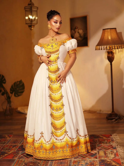Woman in a traditional yellow and white dress standing in a room with decor elements. Yellow Modern Zuria Kemis Elegant Handcrafted Ethiopian Dress ethgebya gebeya