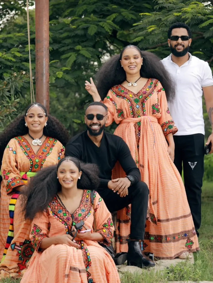 Family of five posing outdoors in traditional attire Gold Sand Ethiopian & Eritrean Axum Habesha Dress Ethgebya