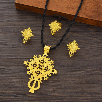 Gold necklace with matching earrings on a wooden surface