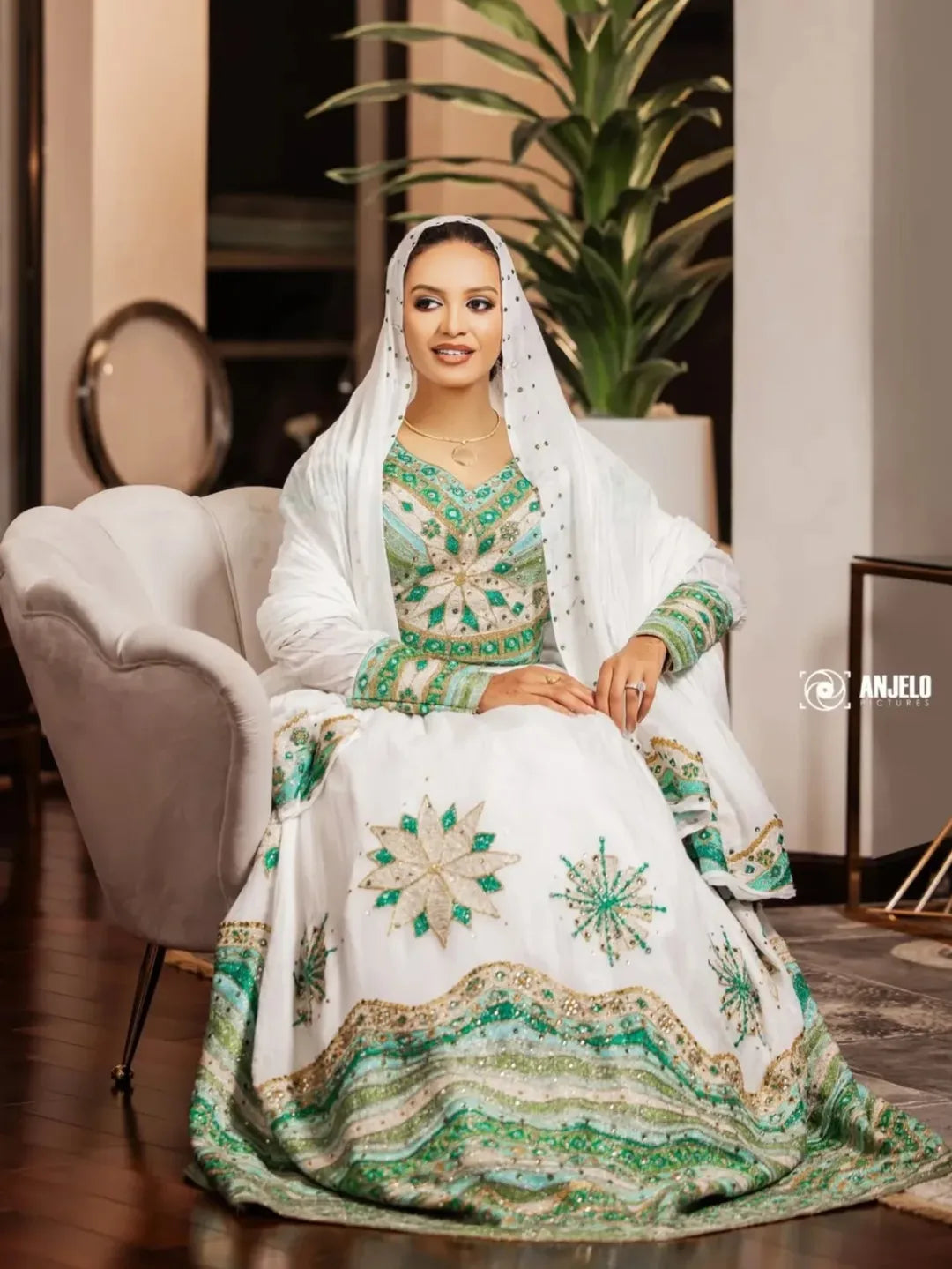 Woman in a traditional embroidered outfit sitting on a chair with a plant in the background Luxury Green Habesha Couple Outfit Matching Ethiopian Attire Set ethgebya gebeya usa habesha couples