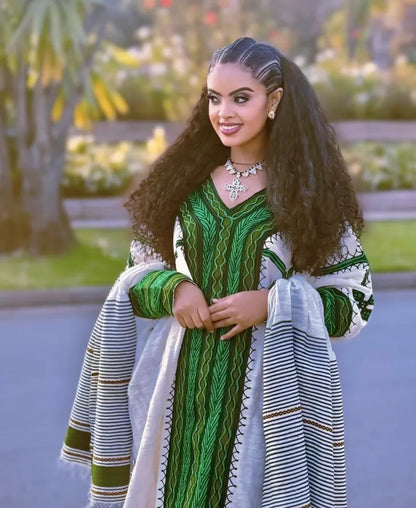 Woman in a green and white traditional outfit standing outdoors with blurred background Modern Green Ethiopian & Eritrean Axum Habesha Dress Handwoven Kemis Ethgebya