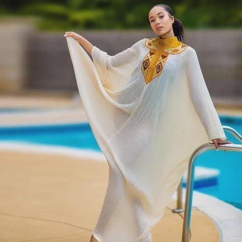 Golden Tilet Neck Ethiopian Dress: Lightweight Traditional Habesha Kemis, Free-Size Handwoven Cultural Outfit for Weddings & Celebrations